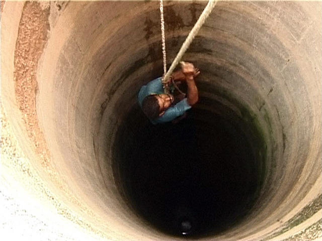 man_well-hanging-by-a-thread-hold-on-struggling-trust-hopeless-lost-helpless-feeling-hanging-by-a-rope-well-water-man-in-well.jpg